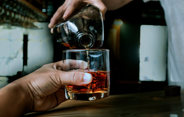 Bartender Serve Whiskey, on wood bar, 