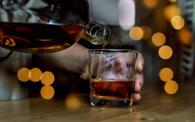 Bartender Serve Whiskey, on wood bar 