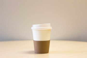 Paper cups of coffee on table