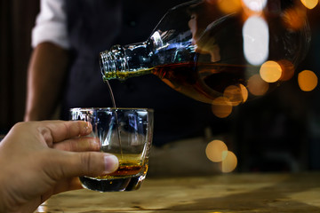 Bartender Serve Whiskey, on wood bar