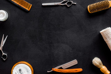 Men's hairdressing tools on black background top view space for text
