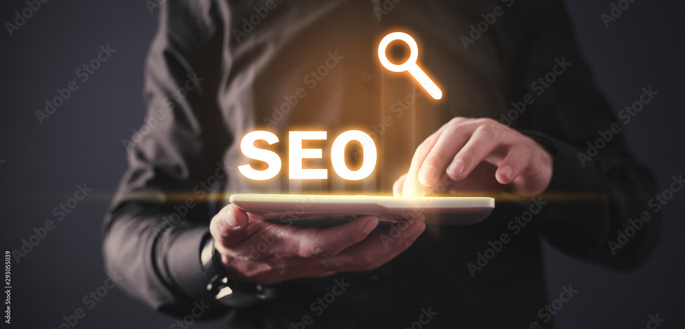 Poster man using white digital tablet. seo - search engine optimization