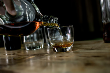 Bartender Serve Whiskey, on wood bar