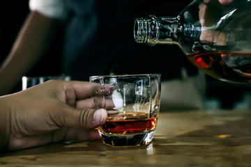 Bartender Serve Whiskey, on wood bar, 