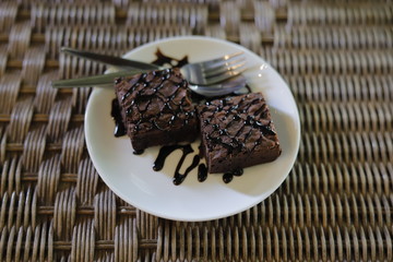 Delicious Chocolate Cake chocolate juice on dish white.