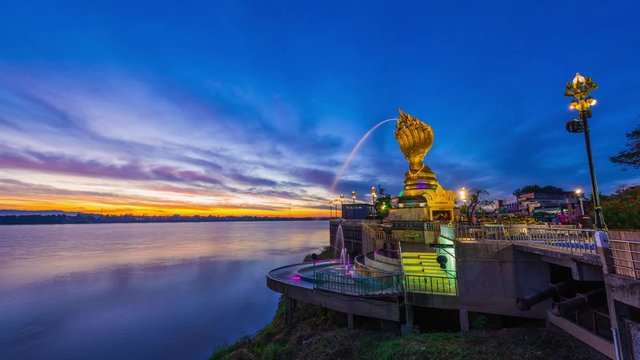 Time lapse 4k,Yard serpent spits water on the Mekong River in Nakhon Phanom with sunrise.	