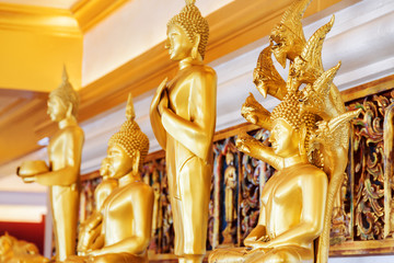 Gilded Buddha statues inside Wat Saket temple, Bangkok, Thailand