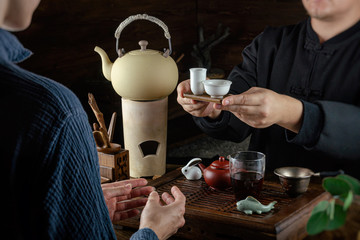 Fototapeta na wymiar tea ceremony hand men and women to pour the tea