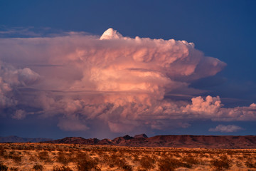Supercell thunderstorm cumulonimbus cloud at sunset - obrazy, fototapety, plakaty