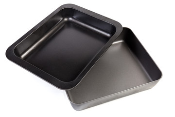 Two empty rectangular nonstick oven trays on white background