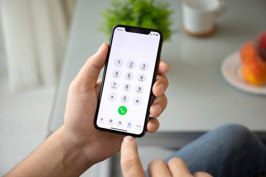 Man Hand Holding IPhone X With Call Number On Screen