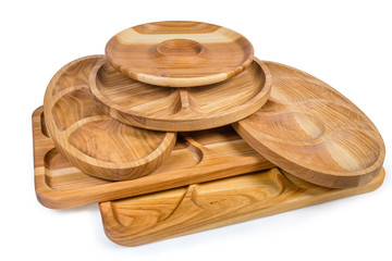 Different wooden compartment dishes and serving boards on white background
