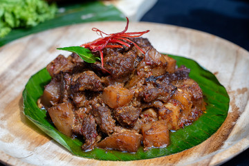 Indonesian dish - fried meat in chili sauce, closeup