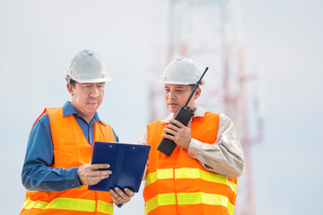 Engineer or Businessman and Architect use portable Radio and Ring binder on Project Development