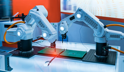 automatic robot for print circuit board (PCB)assembly machine during soldering or welding part at factory