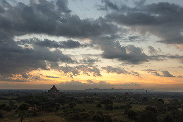 Fototapeta premium Dawn over the ancient Pagan city, Myanmar. The view from the top of Shwesandaw Temple. View of Dhammayangyi Temple.