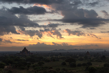 Dawn over the ancient Pagan city, Myanmar. The view from the top of Shwesandaw Temple.  View of Dhammayangyi Temple.