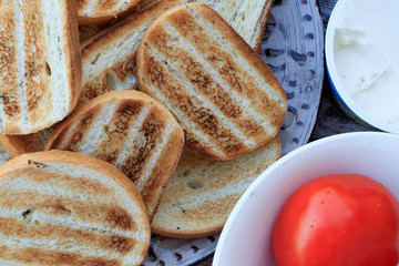 Grilled bread on a wooden table. Healthy breakfast