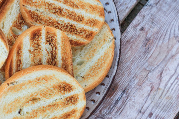 Grilled bread on a wooden table. Healthy breakfast