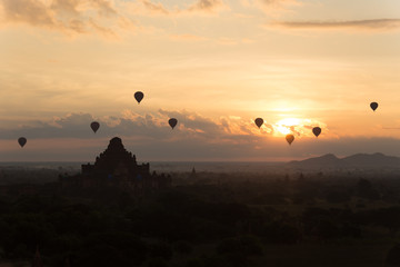 Dawn over the ancient Pagan city, Myanmar. The view from the top of Shwesandaw Temple.  View of Dhammayangyi Temple.