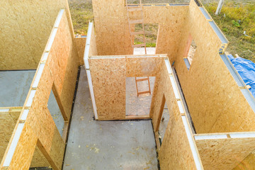 Construction of new and modern modular house. Walls made from composite wooden sip panels with...
