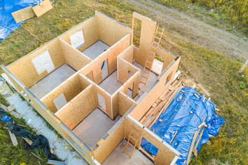 Construction of new and modern modular house. Walls made from composite wooden sip panels with...