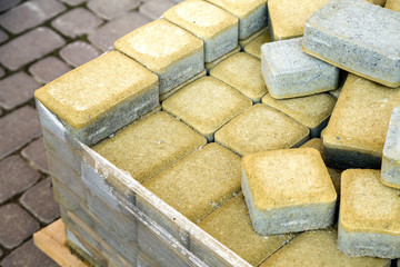 Installation of stone paving slabs in a yard.