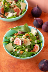 fresh autumn harvest salad with figs, cheese and walnuts