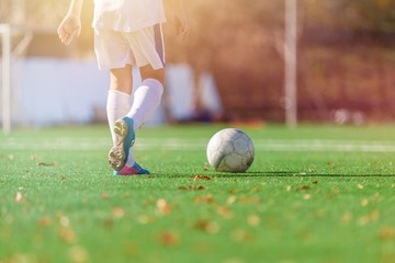 Running soccer player on grass