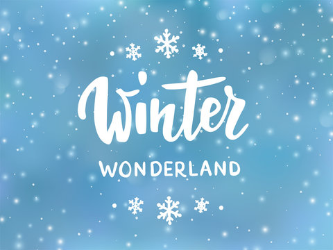 Winter wonderland text, hand drawn brush lettering. Holiday greetings quote. Blue background with falling snow effect.