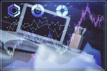 Stock market chart hologram drawn on personal computer background. Double exposure. Concept of investment.