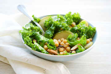 Chickpea salad with pears, kale and almonds. Clean Healthy Food Concept
