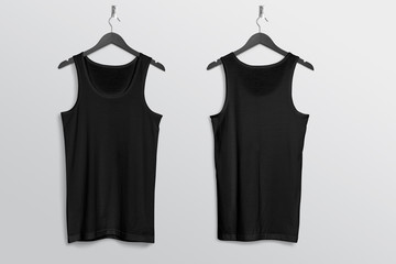 Front back of black plain tank top shirt hanging on wall