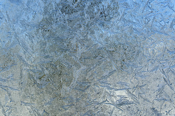 Beautiful natural frosty pattern on winter window.