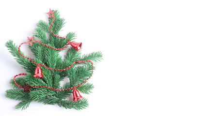 horizontal banner with place for text. Decorative Christmas tree decorated with red beads. Flat lay, minimal layout
