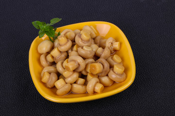 Pickled champignon heap in the bowl
