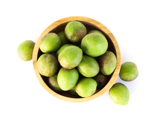 Chebulic Myrobalans in wood bowl isolated on white background, herb and medical