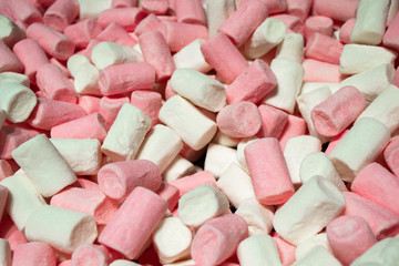 A huge pile of large marshmallows pink and white. Bright and sweet candy background