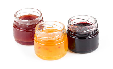 jars full of fresh homemade colorful jams in glass