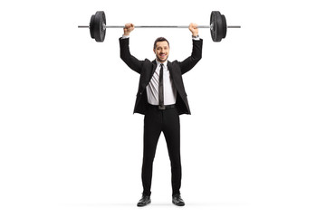 Man in a suit lifting weights and smiling