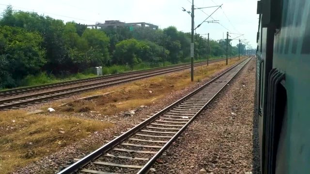 Indian Blue Train Running On Track During morning, Close Up Shot