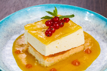 Traditional Cheesecake with orange sauce