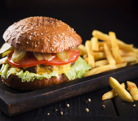 Classic tasty hamburger with potatoes