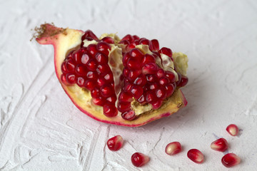 red fresh and ripe pomegranate on a white background