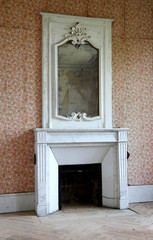 Beautiful wooden frame mirror in old building without people