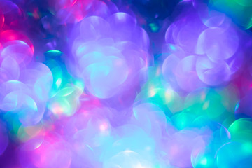 Abstract bokeh background. Blur colorful lights. Purple blurred backgrounds. Festive backdrop, pattern. Creative space. Defocused bright disco lights.