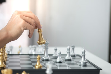 Businessman play with chess game. success management concept of business strategy and tactic...
