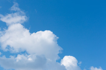 white clouds in the blue sky during