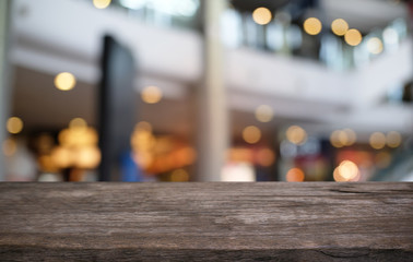 Empty wood table top and blur of night market background/selective focus .For montage product...