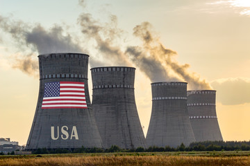 Nuclear plant chimneys with flag of USA ans country name text. Energy polution accidents in a country concept.